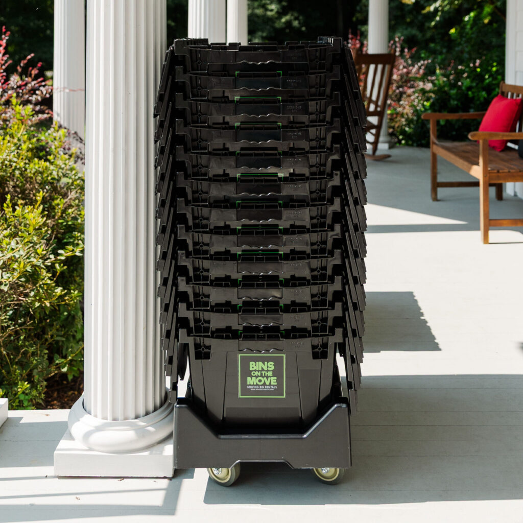 Nested reusable moving bins on dolly.