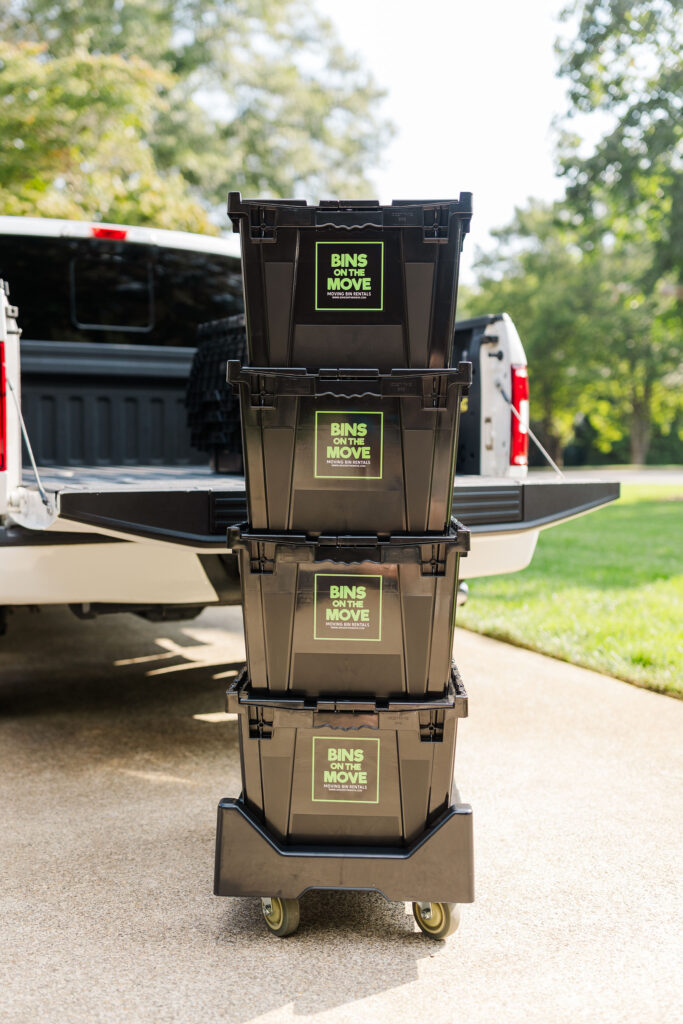 Plastic moving bin in front of truck