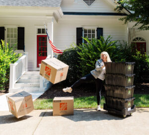 Owner, Kourtney kicking carboard boxes goodbye