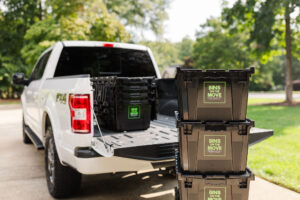 Reusable moving boxes stacked on dolly for delivery – BINS ON THE MOVE Cumming GA